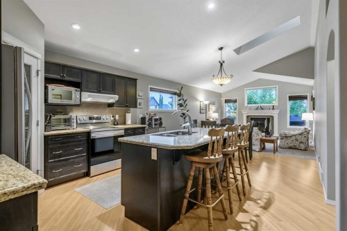 416 Silverado Range Heights Sw, Calgary, AB - Indoor Photo Showing Kitchen With Double Sink