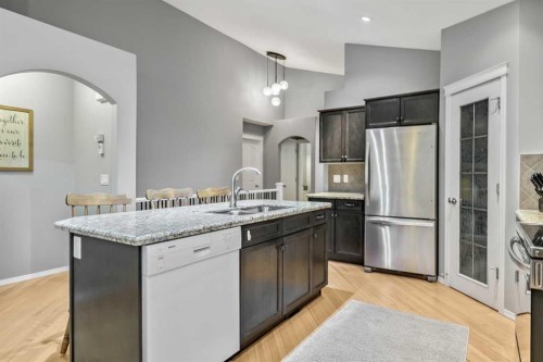 416 Silverado Range Heights Sw, Calgary, AB - Indoor Photo Showing Kitchen With Stainless Steel Kitchen With Double Sink With Upgraded Kitchen