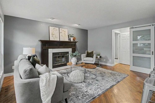 61 Wood Valley Road Sw, Calgary, AB - Indoor Photo Showing Living Room With Fireplace