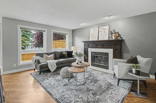 61 Wood Valley Road Sw, Calgary, AB - Indoor Photo Showing Living Room With Fireplace