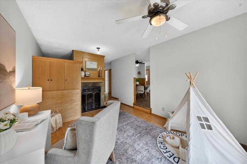 1837 Meadowbrook Drive Se, Airdrie, AB - Indoor With Fireplace