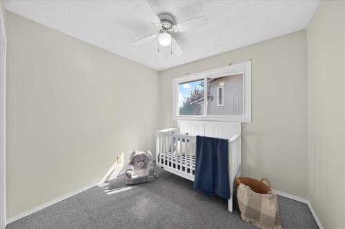 1837 Meadowbrook Drive Se, Airdrie, AB - Indoor Photo Showing Bedroom