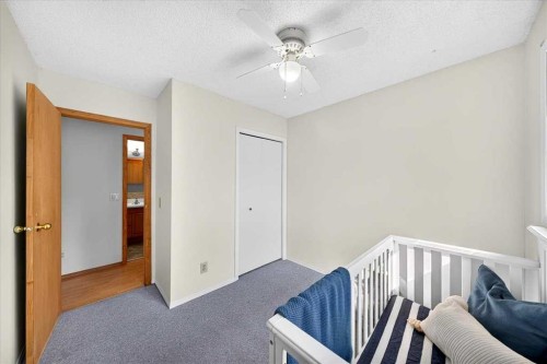 1837 Meadowbrook Drive Se, Airdrie, AB - Indoor Photo Showing Bedroom