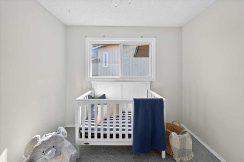 1837 Meadowbrook Drive Se, Airdrie, AB - Indoor Photo Showing Bedroom
