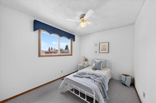 1837 Meadowbrook Drive Se, Airdrie, AB - Indoor Photo Showing Bedroom