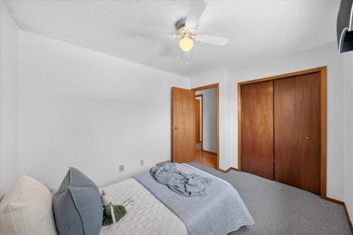 1837 Meadowbrook Drive Se, Airdrie, AB - Indoor Photo Showing Bedroom