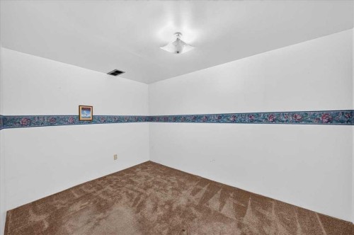 1837 Meadowbrook Drive Se, Airdrie, AB - Indoor Photo Showing Other Room