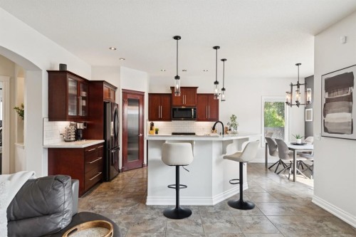 97 Tanner Close Se, Airdrie, AB - Indoor Photo Showing Kitchen With Upgraded Kitchen