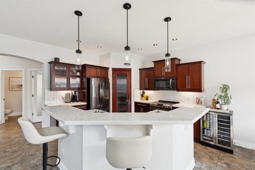 97 Tanner Close Se, Airdrie, AB - Indoor Photo Showing Kitchen With Upgraded Kitchen