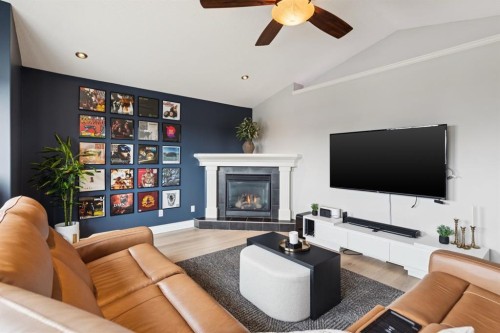 97 Tanner Close Se, Airdrie, AB - Indoor Photo Showing Living Room With Fireplace
