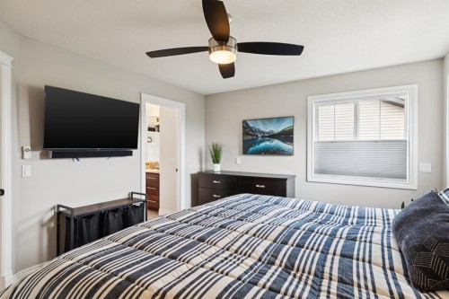 97 Tanner Close Se, Airdrie, AB - Indoor Photo Showing Bedroom