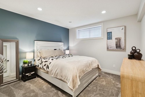 97 Tanner Close Se, Airdrie, AB - Indoor Photo Showing Bedroom