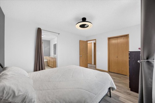 2745 Coopers Manor Sw, Airdrie, AB - Indoor Photo Showing Bedroom