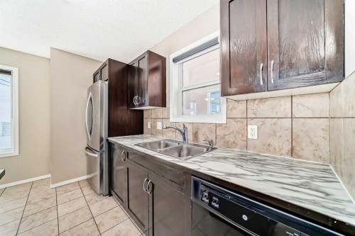 52 Taralake Street Ne, Calgary, AB - Indoor Photo Showing Kitchen With Double Sink