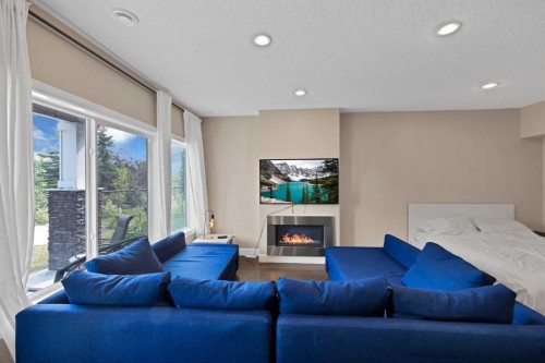 146 Canoe Crescent Sw, Airdrie, AB - Indoor Photo Showing Living Room With Fireplace
