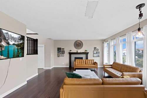 146 Canoe Crescent Sw, Airdrie, AB - Indoor Photo Showing Living Room With Fireplace