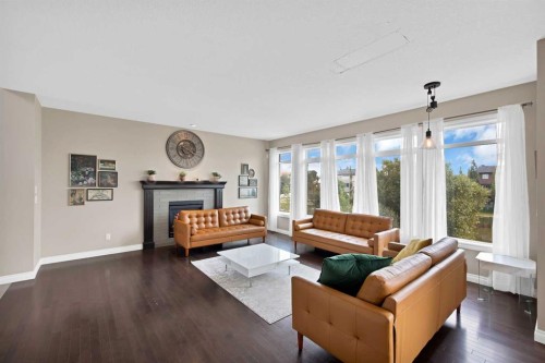 146 Canoe Crescent Sw, Airdrie, AB - Indoor Photo Showing Living Room With Fireplace