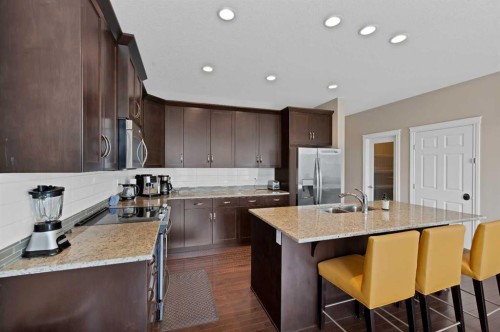 146 Canoe Crescent Sw, Airdrie, AB - Indoor Photo Showing Kitchen With Double Sink With Upgraded Kitchen