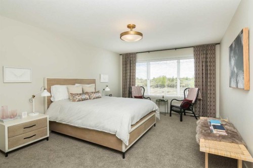 542 Rivercrest View, Cochrane, AB - Indoor Photo Showing Bedroom