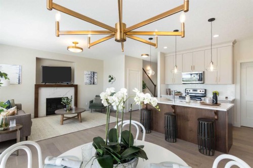 542 Rivercrest View, Cochrane, AB - Indoor Photo Showing Kitchen With Upgraded Kitchen