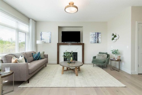 542 Rivercrest View, Cochrane, AB - Indoor Photo Showing Living Room With Fireplace