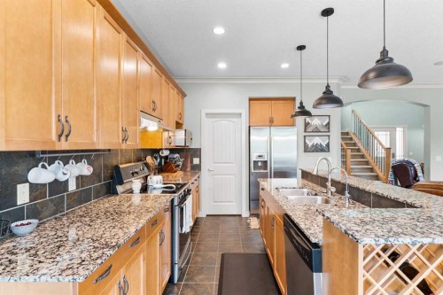 19 Sunset Circle, Cochrane, AB - Indoor Photo Showing Kitchen With Double Sink With Upgraded Kitchen