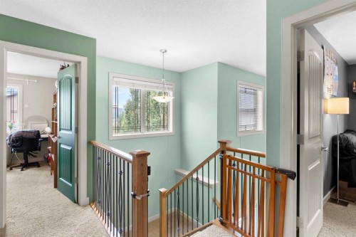 19 Sunset Circle, Cochrane, AB - Indoor Photo Showing Other Room