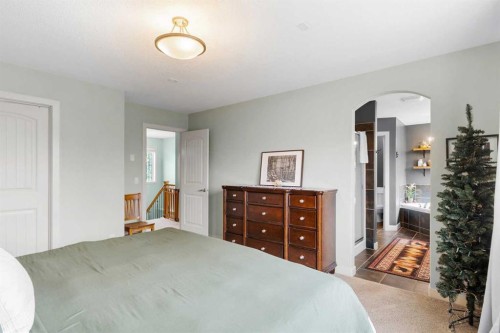 19 Sunset Circle, Cochrane, AB - Indoor Photo Showing Bedroom