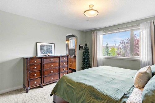 19 Sunset Circle, Cochrane, AB - Indoor Photo Showing Bedroom