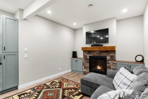 19 Sunset Circle, Cochrane, AB - Indoor Photo Showing Living Room With Fireplace