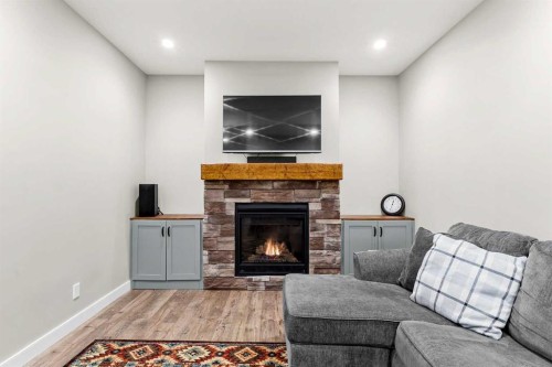 19 Sunset Circle, Cochrane, AB - Indoor Photo Showing Living Room With Fireplace