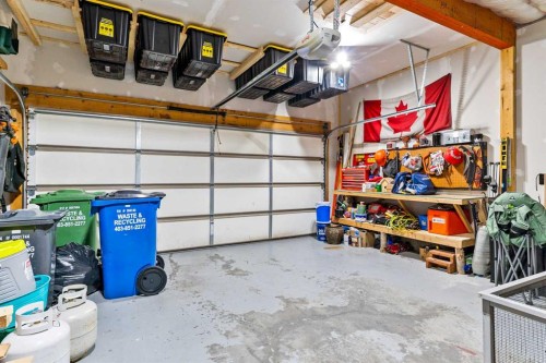 19 Sunset Circle, Cochrane, AB - Indoor Photo Showing Garage