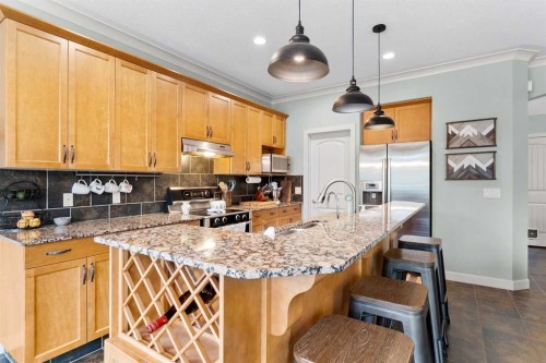 19 Sunset Circle, Cochrane, AB - Indoor Photo Showing Kitchen With Upgraded Kitchen