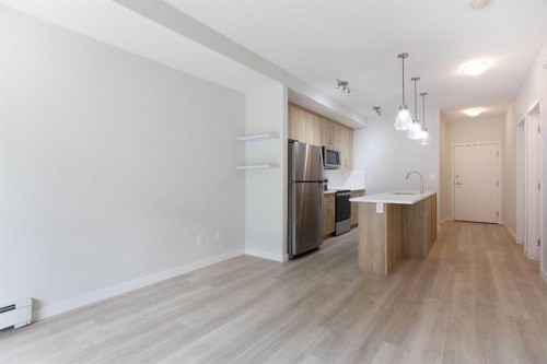 206-71 Shawnee Common Sw, Calgary, AB - Indoor Photo Showing Kitchen