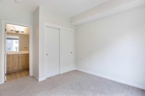 206-71 Shawnee Common Sw, Calgary, AB - Indoor Photo Showing Other Room