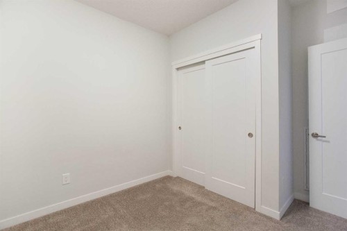 206-71 Shawnee Common Sw, Calgary, AB - Indoor Photo Showing Other Room