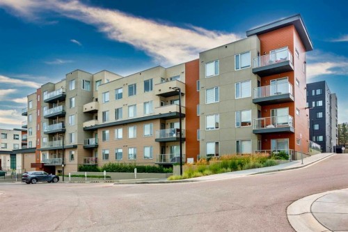206-71 Shawnee Common Sw, Calgary, AB - Outdoor With Facade