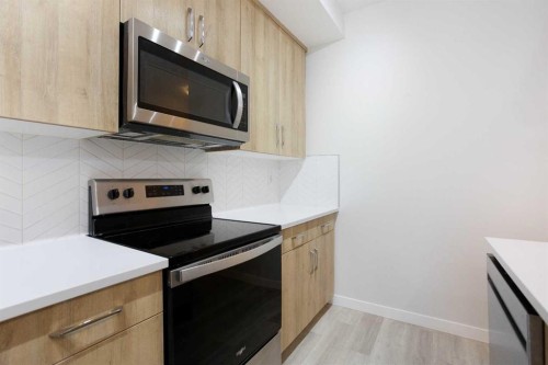 206-71 Shawnee Common Sw, Calgary, AB - Indoor Photo Showing Kitchen