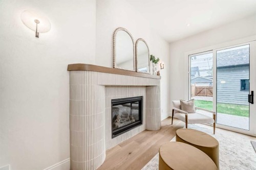 1612 49 Avenue Sw, Calgary, AB - Indoor Photo Showing Living Room With Fireplace