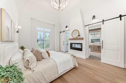 1612 49 Avenue Sw, Calgary, AB - Indoor Photo Showing Bedroom With Fireplace