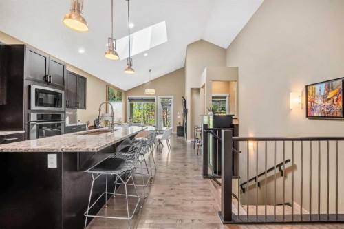 63 Cortina Villas Sw, Calgary, AB - Indoor Photo Showing Kitchen With Upgraded Kitchen
