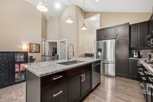 63 Cortina Villas Sw, Calgary, AB - Indoor Photo Showing Kitchen With Upgraded Kitchen