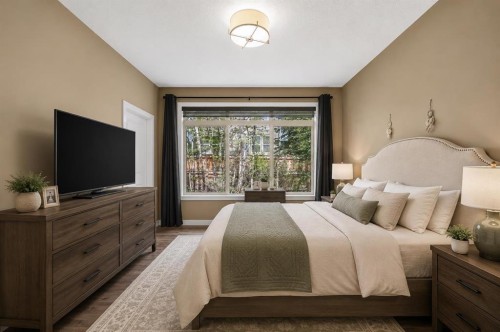 63 Cortina Villas Sw, Calgary, AB - Indoor Photo Showing Bedroom