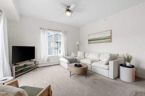 4418-99 Copperstone Park Se, Calgary, AB - Indoor Photo Showing Living Room