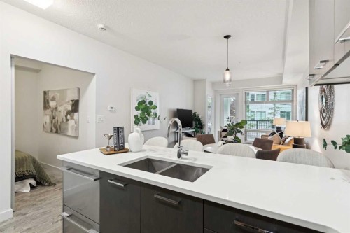 208-323 20 Avenue Sw, Calgary, AB - Indoor Photo Showing Kitchen With Double Sink