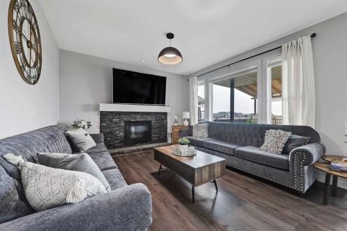 268 Rainbow Falls Way, Chestermere, AB - Indoor Photo Showing Living Room With Fireplace
