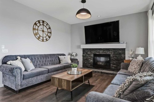 268 Rainbow Falls Way, Chestermere, AB - Indoor Photo Showing Living Room With Fireplace