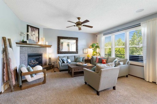 382 Tuscany Ravine Road Nw, Calgary, AB - Indoor Photo Showing Living Room With Fireplace