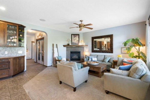 382 Tuscany Ravine Road Nw, Calgary, AB - Indoor Photo Showing Living Room With Fireplace
