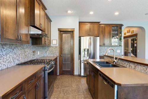 382 Tuscany Ravine Road Nw, Calgary, AB - Indoor Photo Showing Kitchen With Stainless Steel Kitchen With Double Sink With Upgraded Kitchen